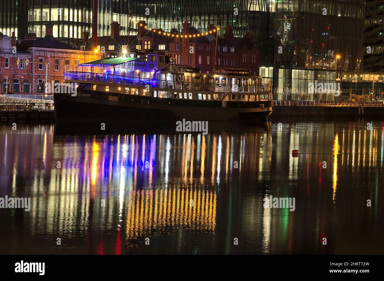 Dublin, Ireland - November 13, 2021: Beautiful closeup evening view of MV Cill Airne restaurant in renovated training vessel with maritime-style bar Stock Photo