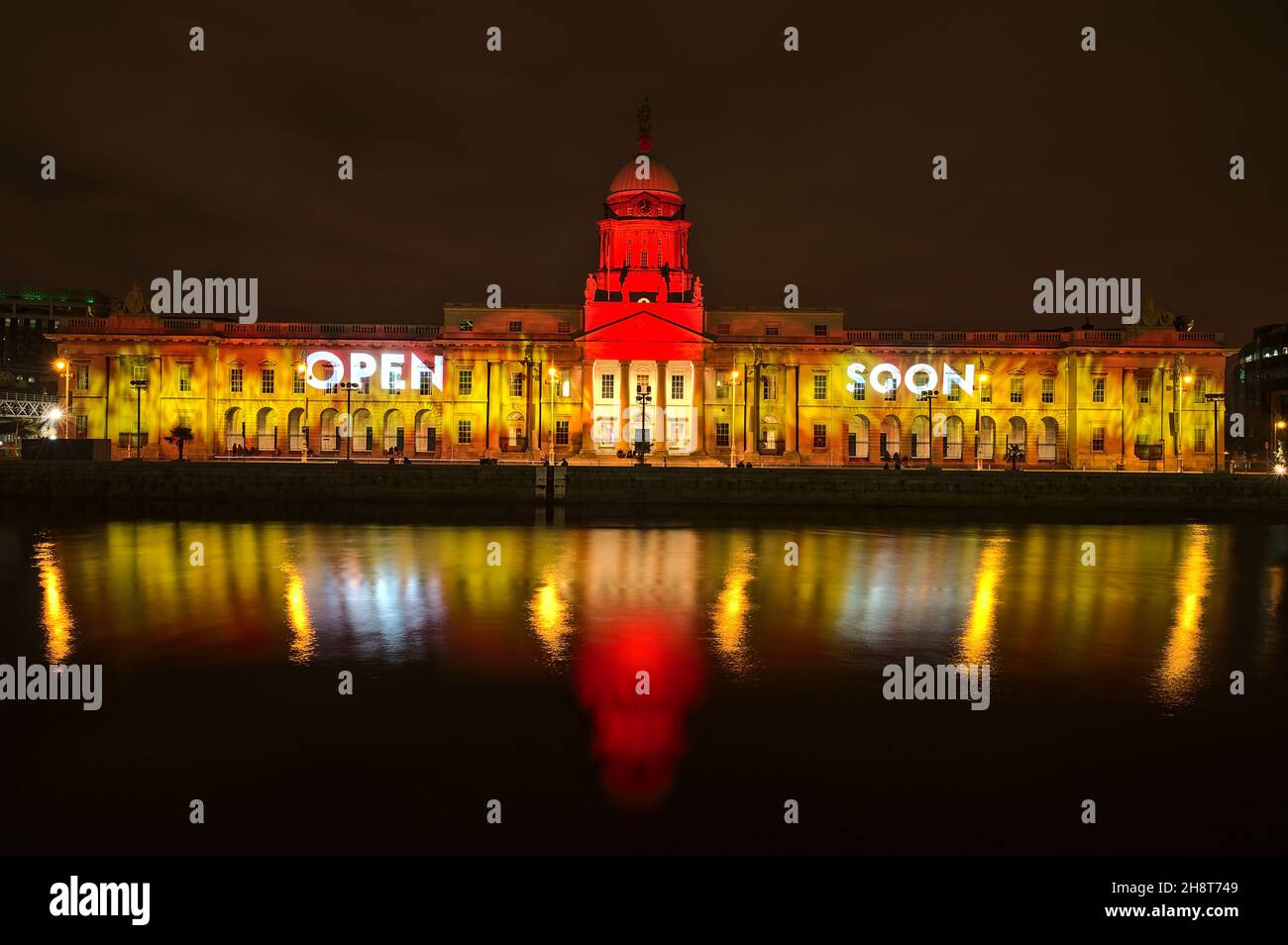 Dublin, Ireland - November 13. 2021: Beautiful wide angle view of The Custom House decorated for Christmas in yellow and red colors with 'open soon' Stock Photo