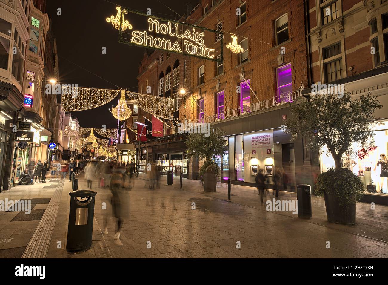 Dublin, Ireland - November 13. 2021:  Evening view of Nollaig shona dhuit Christmas lights. Merry Christmas signboard written in Irish language Stock Photo