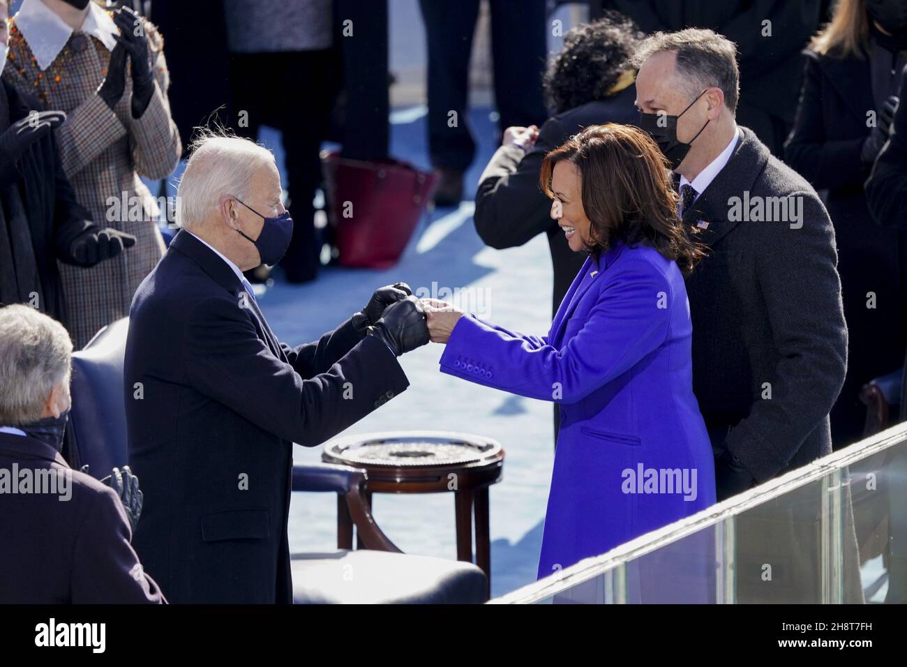 Washington, United States. 02nd Dec, 2021. U.S. President Joe Biden, left, fist bumps Vice President Kamala Harris during the 59th presidential inauguration in Washington, DC, on Wednesday, January 20, 2021. Biden will propose a broad immigration overhaul on his first day as president, including a shortened pathway to U.S. citizenship for undocumented migrants - a complete reversal from Donald Trump's immigration restrictions and crackdowns, but one that faces major roadblocks in Congress. Photo by Kevin Dietsch/UPI Credit: UPI/Alamy Live News Stock Photo