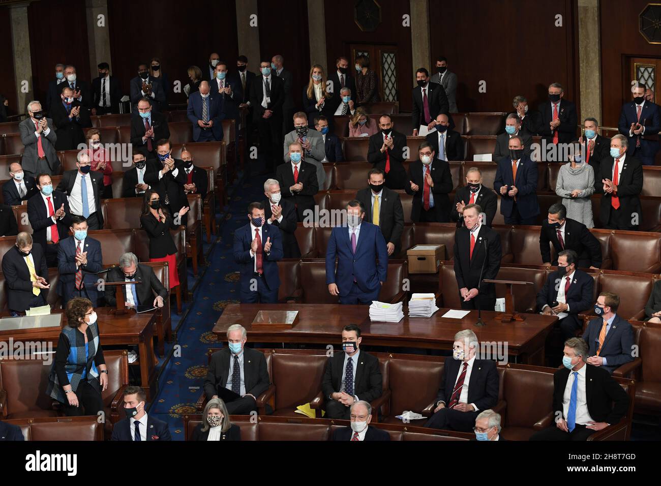 Washington, United States. 02nd Dec, 2021. Some members of Congress applaud as Rep. Paul Gosar, R-AZ, (R-C) and Sen. Ted Cruz, R-TX, (C) object to the certification of Arizona's Electoral College votes during a joint session of Congress at the U.S. Capitol in Washington, DC, on Wednesday, January 6, 2021. Congress split into two sessions to debate the issue as demonstrators stormed the building. Photo by Pat Benic/UPI Credit: UPI/Alamy Live News Stock Photo
