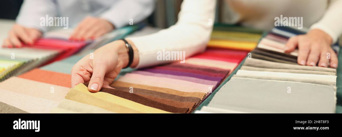 Buyer and seller choose color of fabric closeup Stock Photo