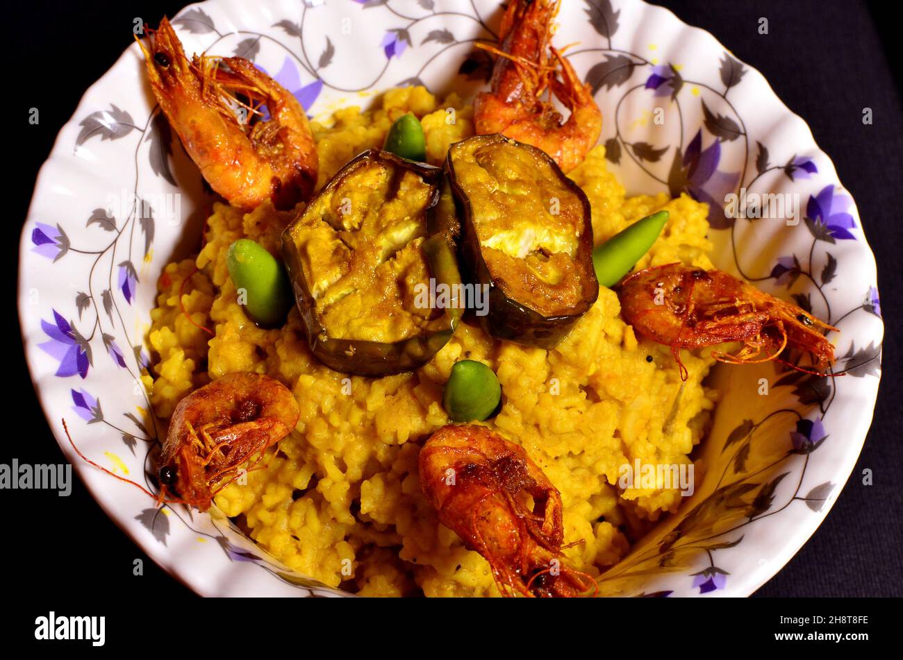 The best food of Bengal Dish is Khichdi, fried eggplant and fried shrimp Stock Photo