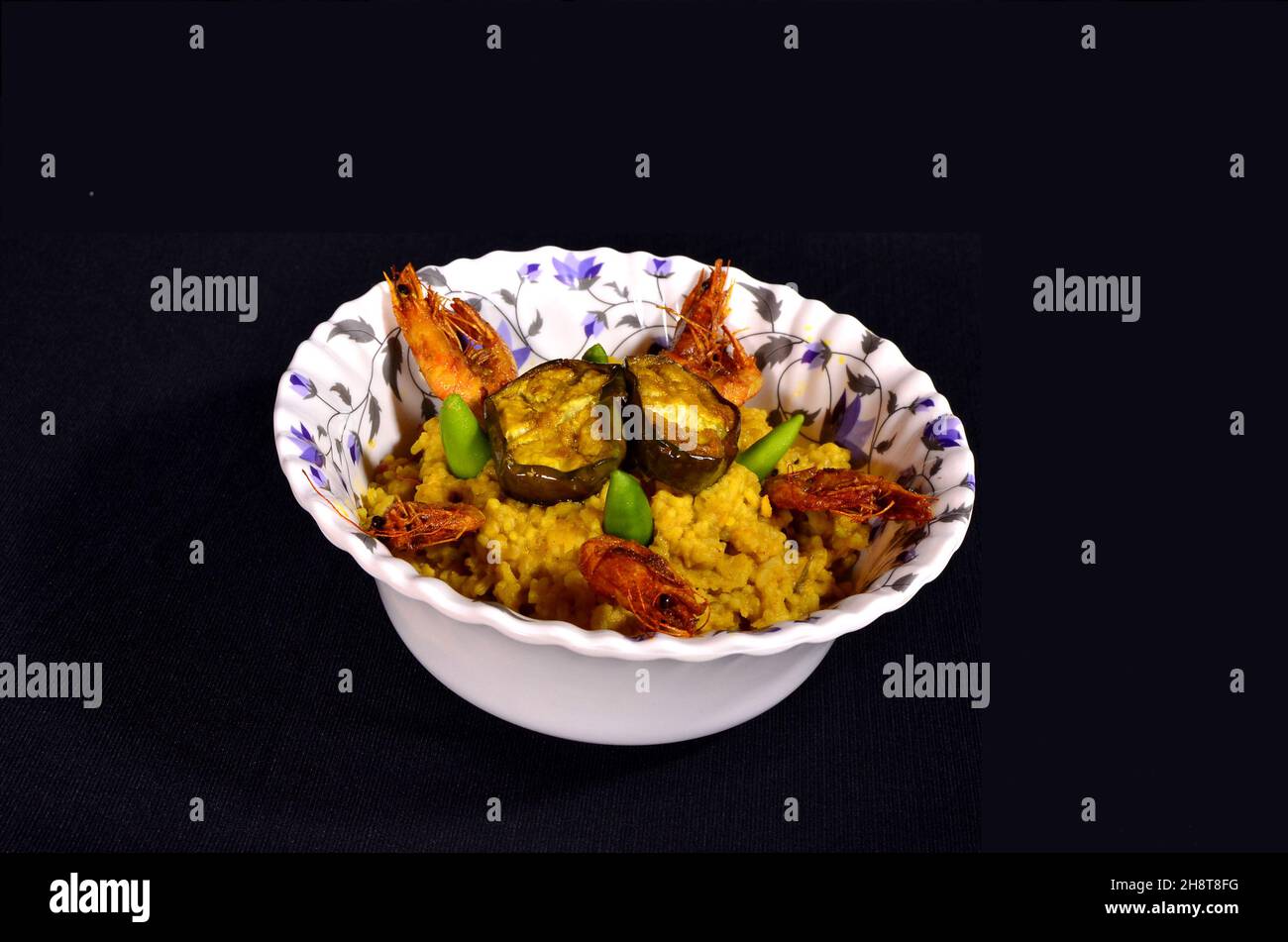 The best food of Bengal Dish is Khichdi, fried eggplant and fried shrimp Stock Photo