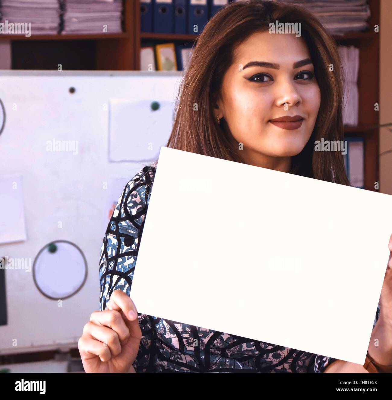 woman holding a blank paper Stock Photo