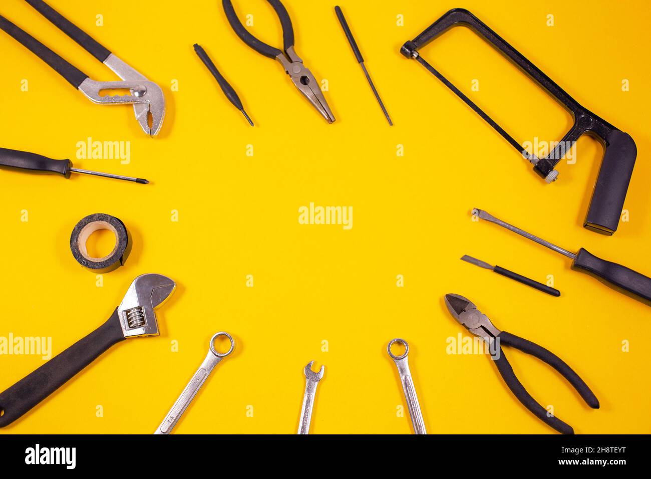 Construction tools for repairs Various carpentry on yellow background. Top view with space for text. Stock Photo