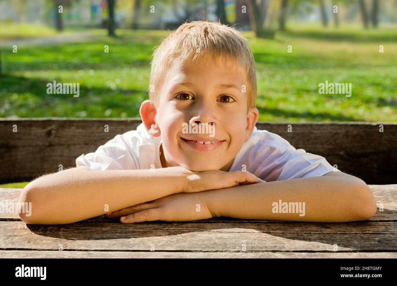 Photo of adorable young boy looking at camera Stock Photo - Alamy