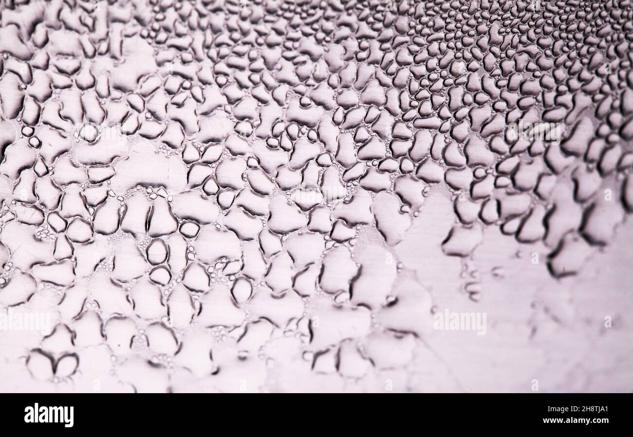 Macro background with water droplets condensation pattern on metal ...