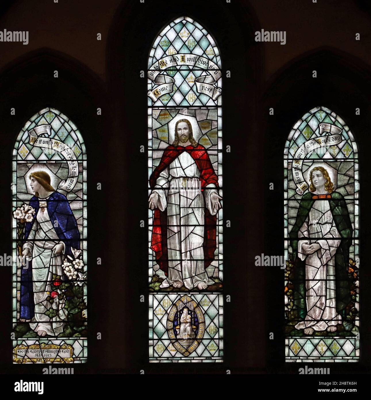 A stained glass window possibly by Percy Bacon & Brothers: Christ Consoler, St John & Blessed Virgin Mary, St Mary's Church, Usk, Monmouthshire Stock Photo
