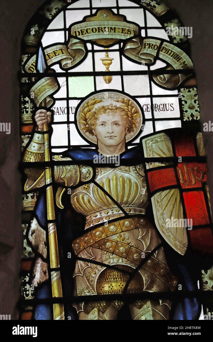 Stained glass window of 1921 by Percy Bacon depicting St George, St James Church, Shere, Surrey. Dedicated to the fallen of the parish Stock Photo