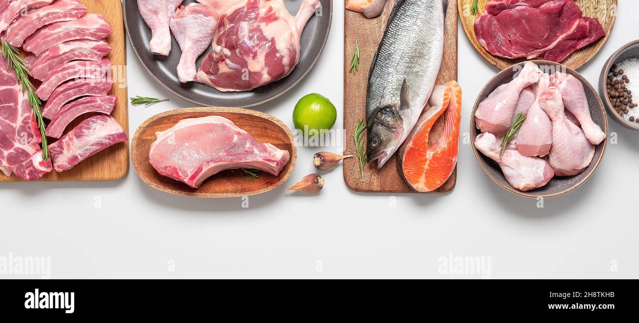 Assortment of raw fresh meat on gray pastel background. Beef, pork