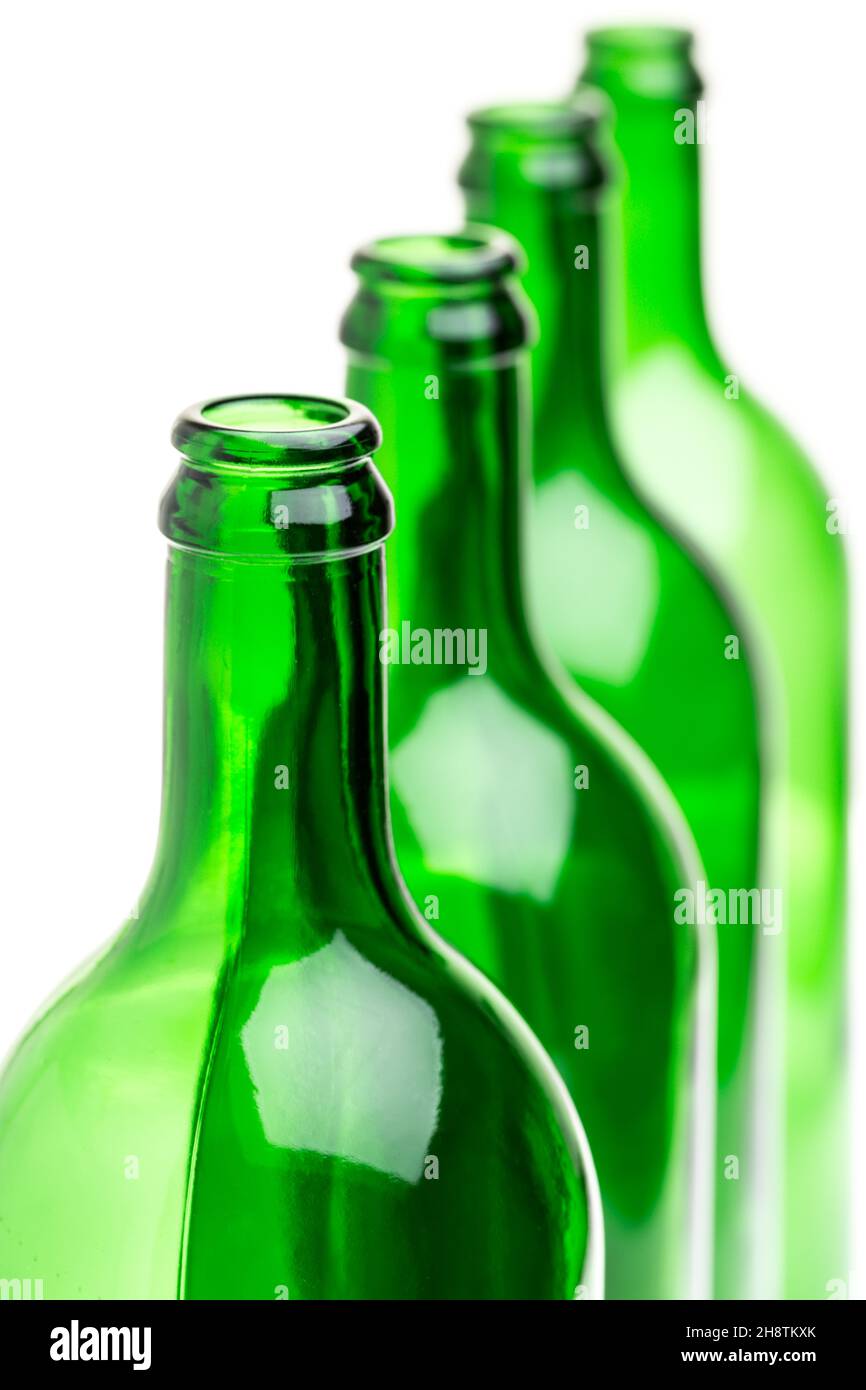 Green bottles standing in a row on white background Stock Photo