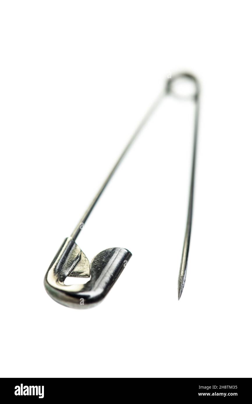 Safety pin isolated on white background Stock Photo