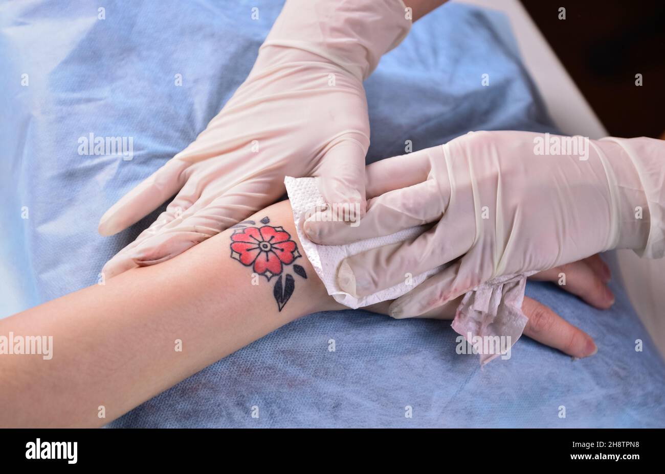 Tattoo artist posing in studio Stock Photo - Alamy