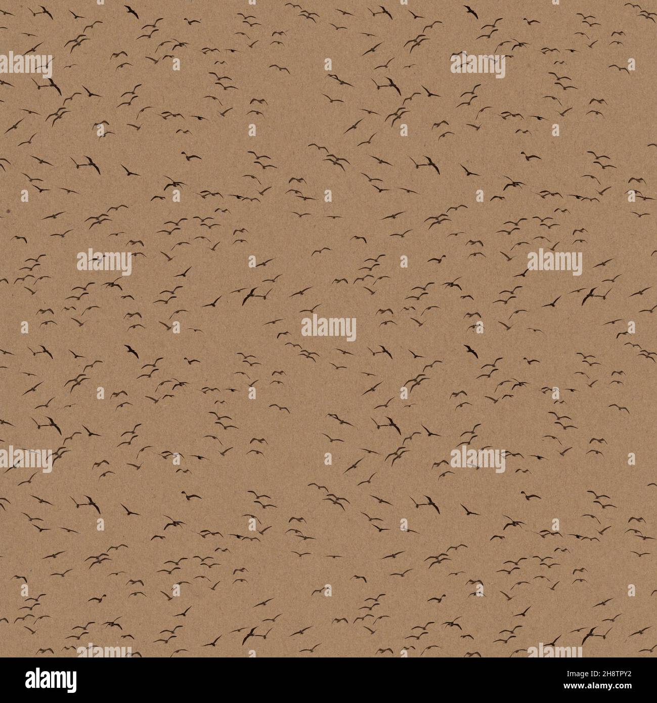 stylish textured craft paper background with a flock of flying seagulls ...