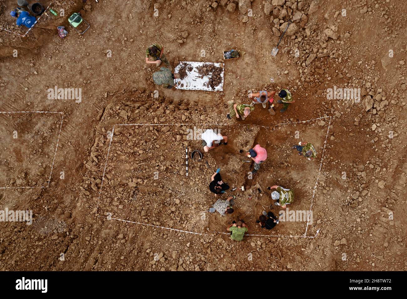 Excavations at the site of a war crime. Site of a mass shooting of ...