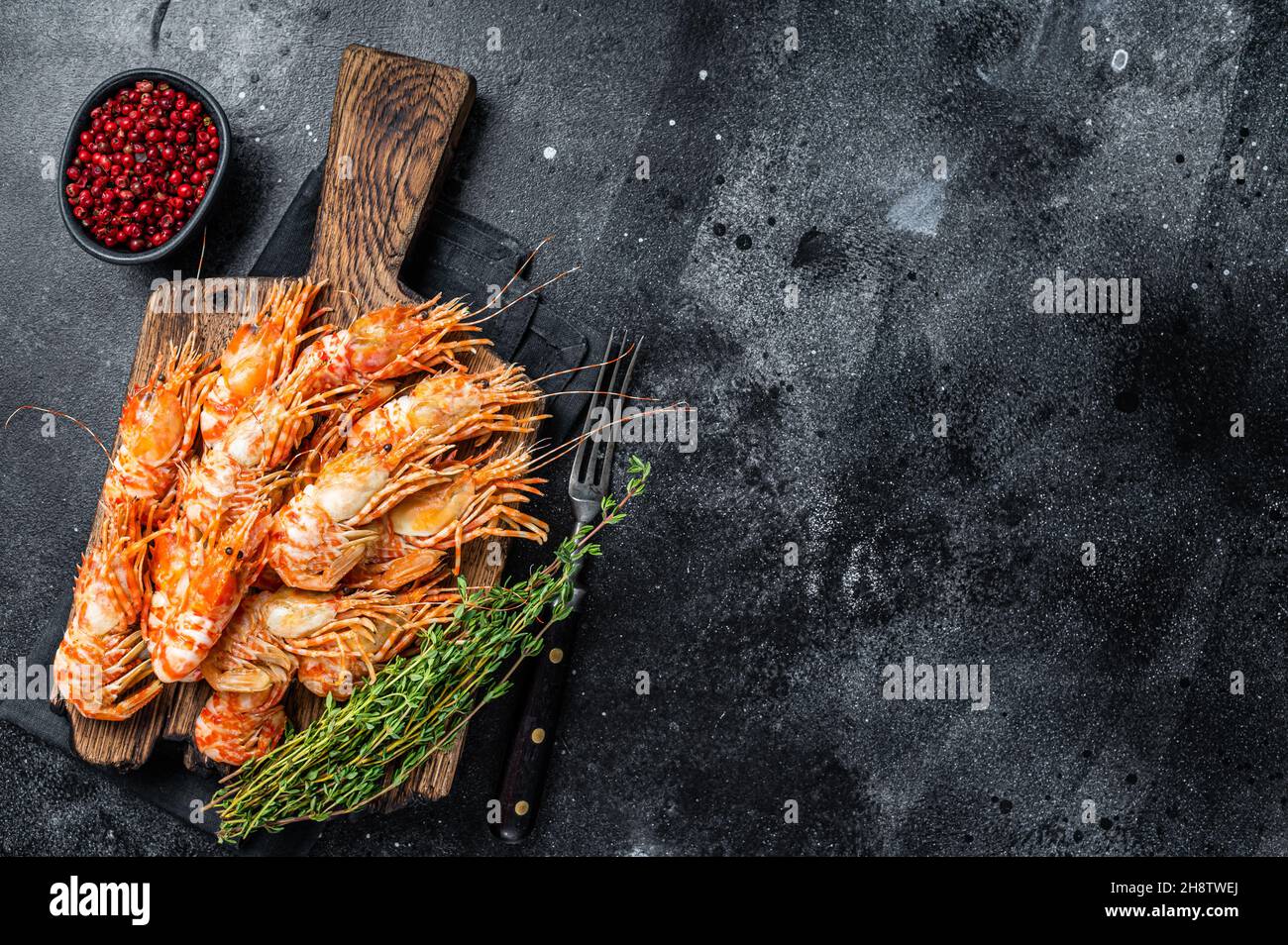 Cooked Greenland Prawn Shrimp on a wooden board. Black background. Top  view. Copy space Stock Photo - Alamy
