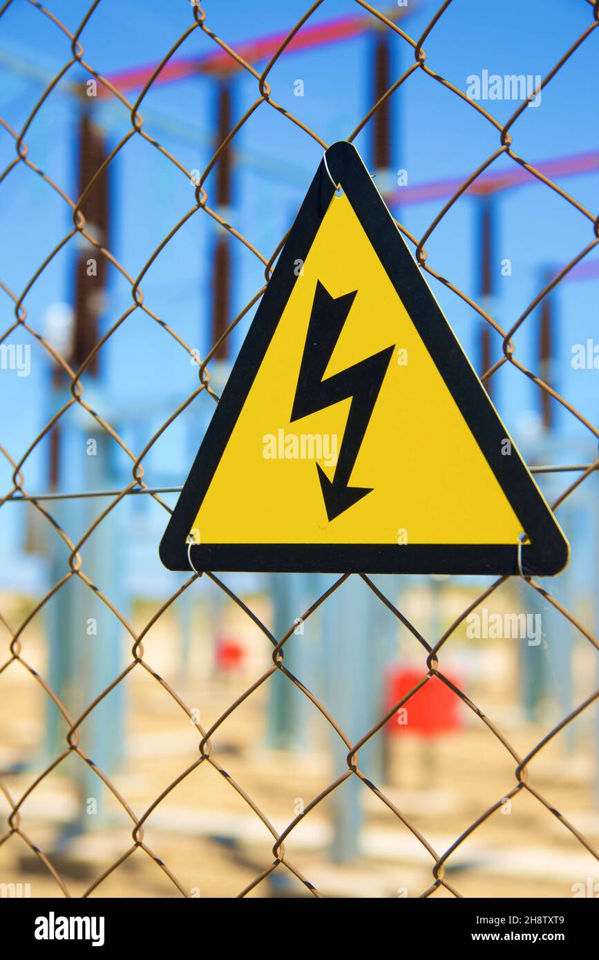 Electrical hazard sign placed on a metal fence Stock Photo Alamy