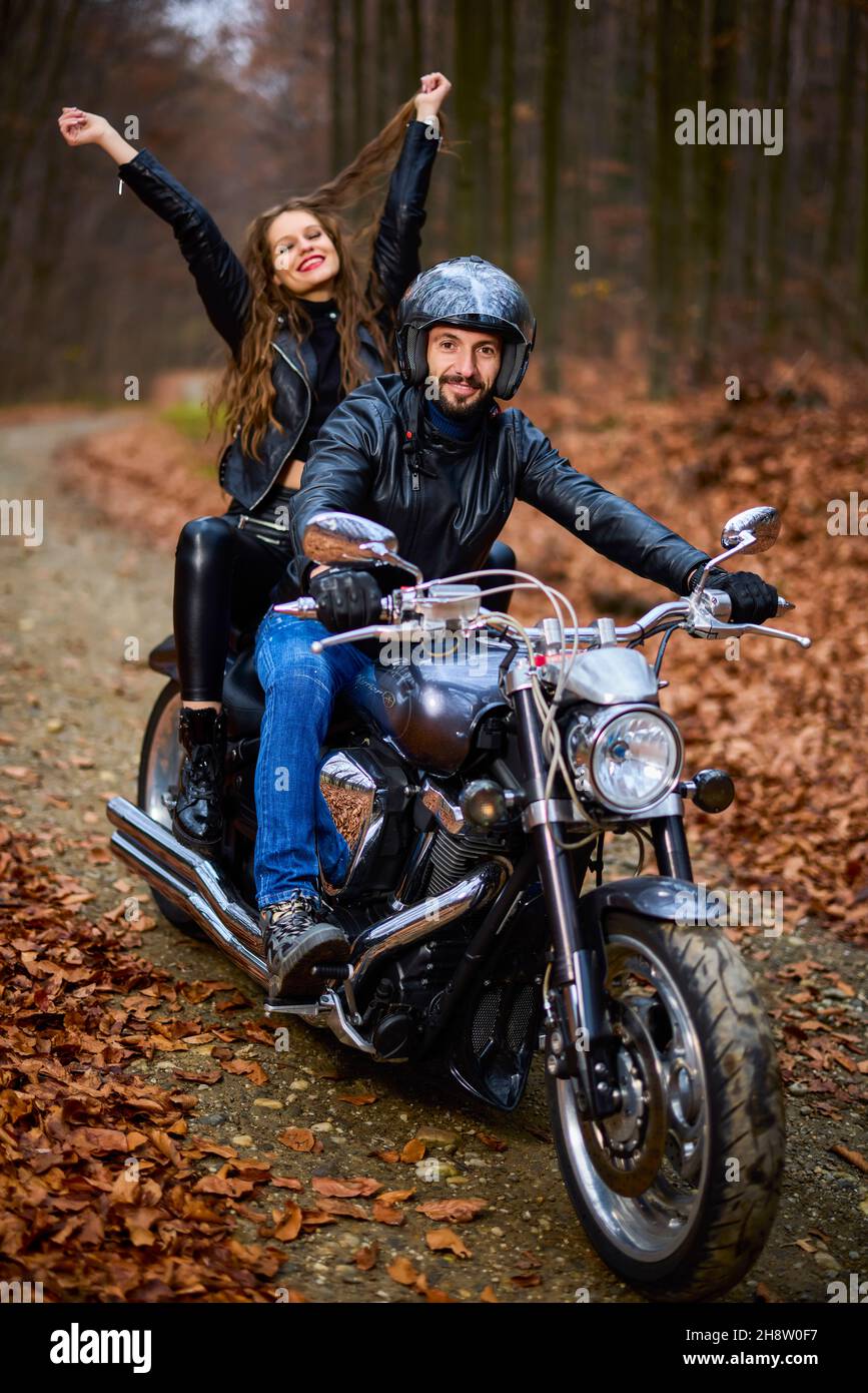 A Young Couple Posing Together on a Motorcycle · Free Stock Photo