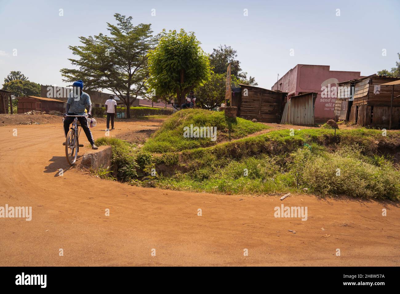 African man he rides a bicycle. Stock Photo