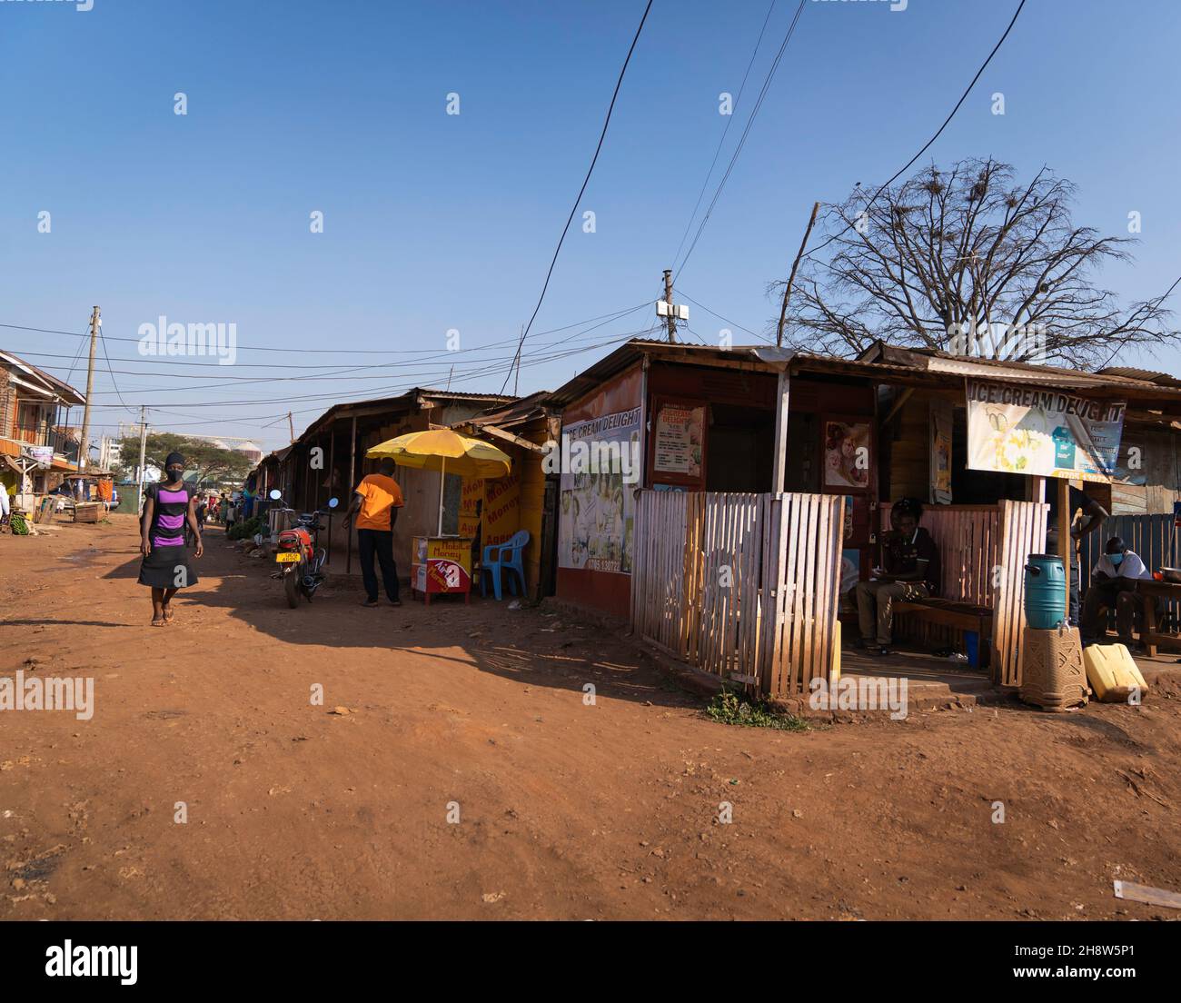 Local fruits and vegetables are sold along the road. Uganda is located in the northwest of the East African. Stock Photo