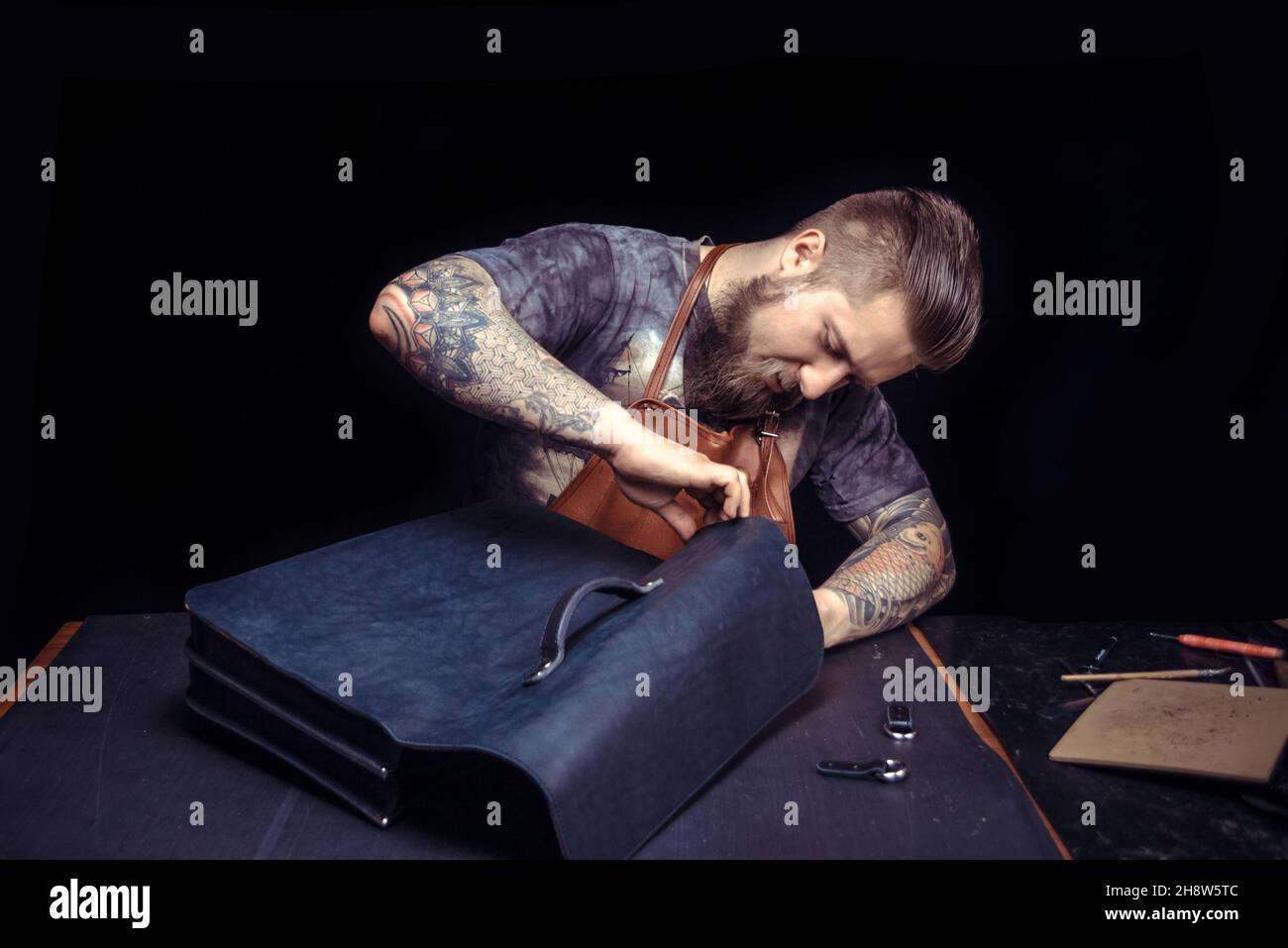 Leather Artist being keen on his buisness Stock Photo