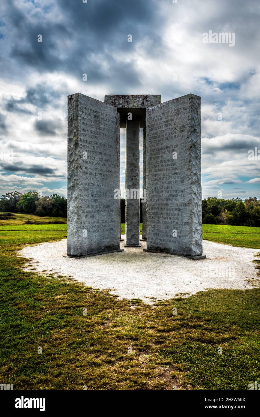 ELBERTON, UNITED STATES - Oct 25, 2021: The Georgia Guidestones near Elberton with English, Russian, and cuneiform inscriptions under a cloudy sky Stock Photo