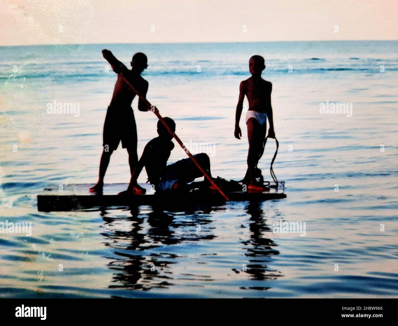 Boys rowing the boat. Freeport Grand Bahama, The Bahamas Stock Photo