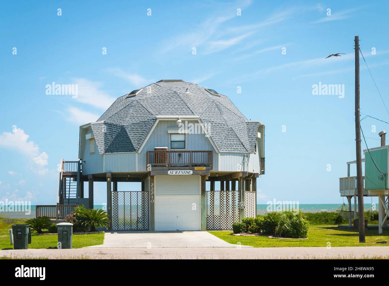 geodesic domed house house on stilts by the ocean in Galveston Texas