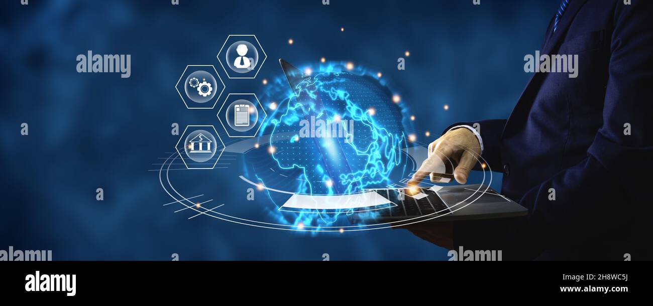 Hand of businessman holding laptop with trends of online connection metaverse technology and digital innovation businesses concept, hand of businessma Stock Photo