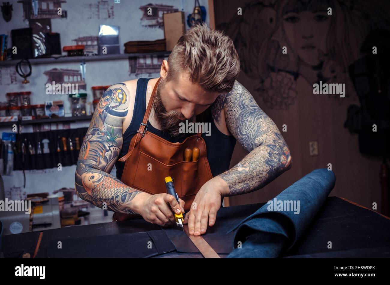 Man working with leather produces leather goods Stock Photo