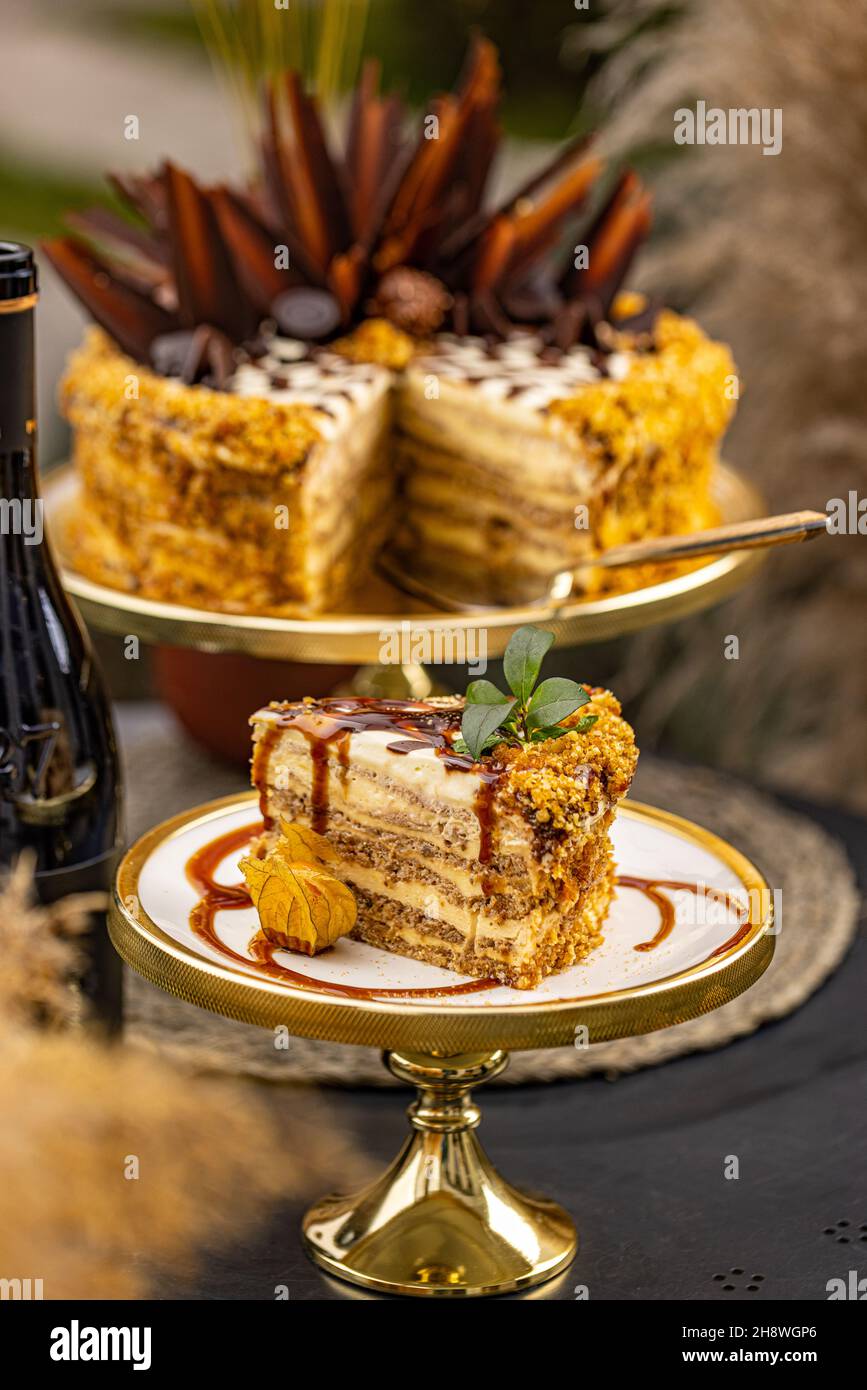 Fancy layered walnut cake with caramel topping, cake lovers concept Stock Photo