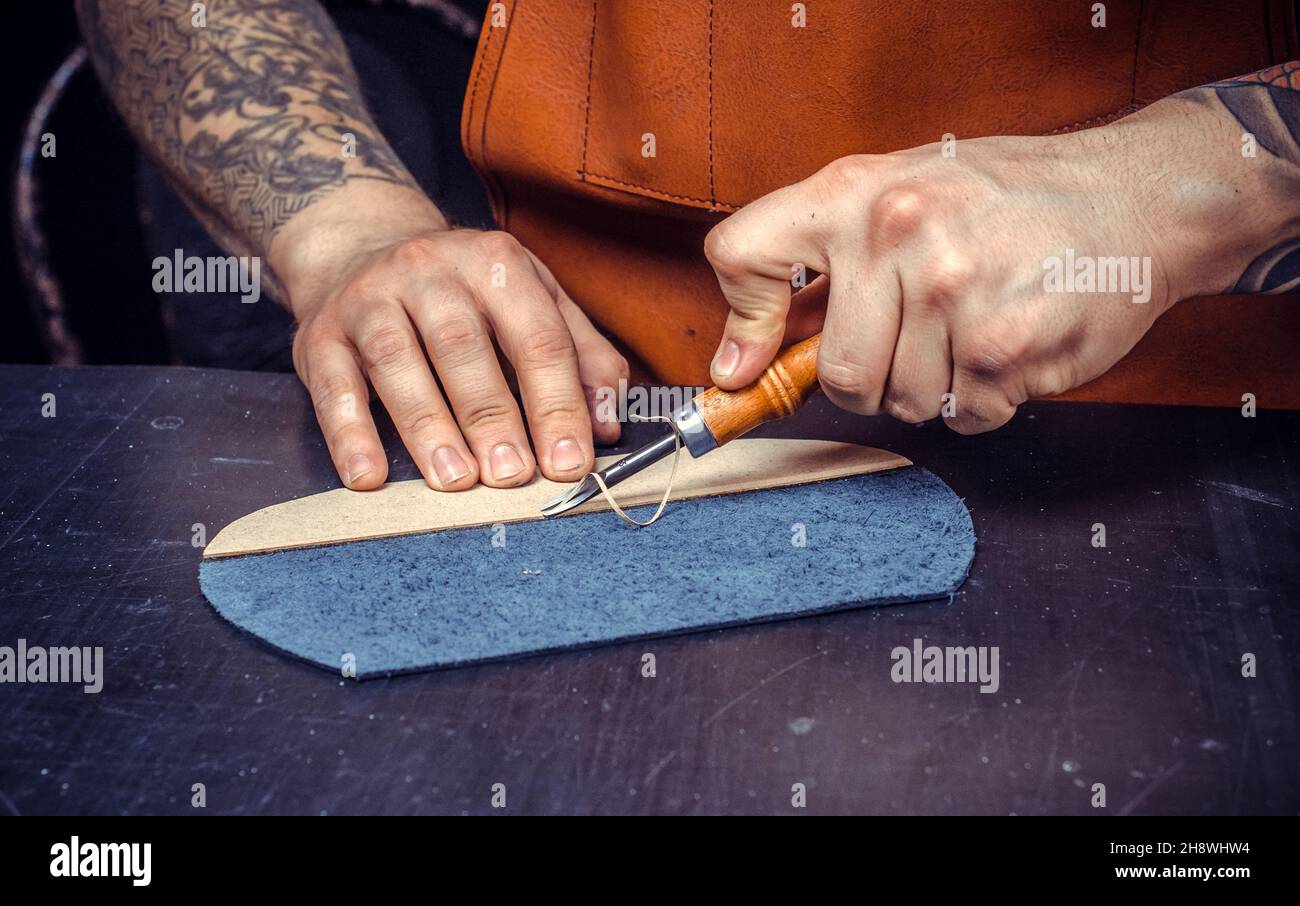 Worker leather works goods hi-res stock photography and images - Alamy