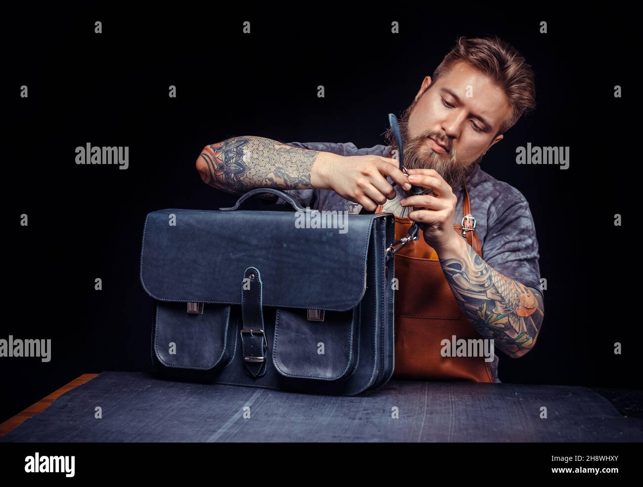 Professional Tanner creates a new leather product Stock Photo