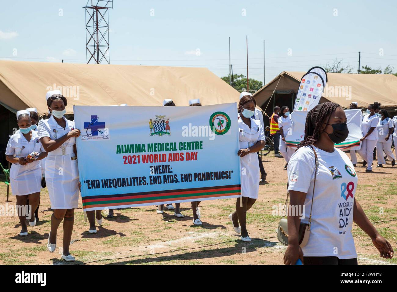 LUSAKA, Dec. 2, 2021 (Xinhua) Medical workers march during an event