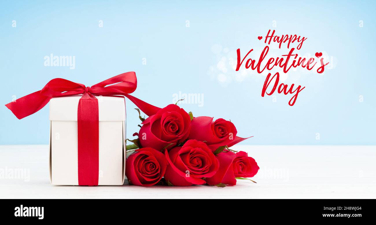 Valentines day greeting card with red rose flowers bouquet and gift box ...