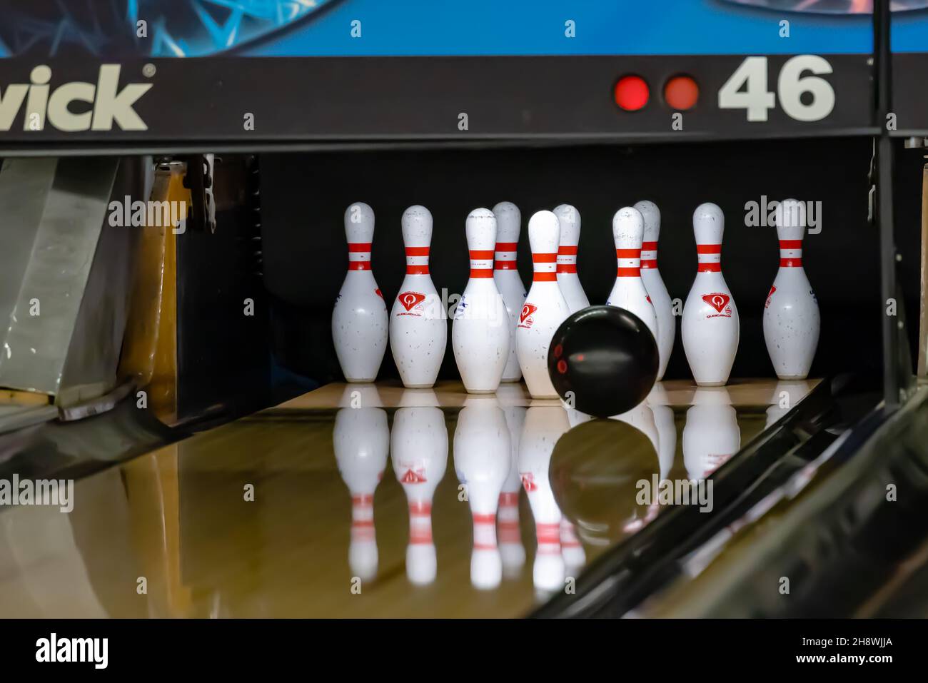 Bowling ball hitting pins at a bowling alley Stock Photo Alamy