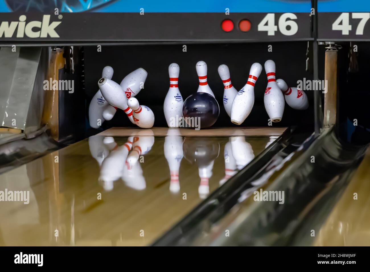 Bowling ball hitting pins at a bowling alley Stock Photo Alamy