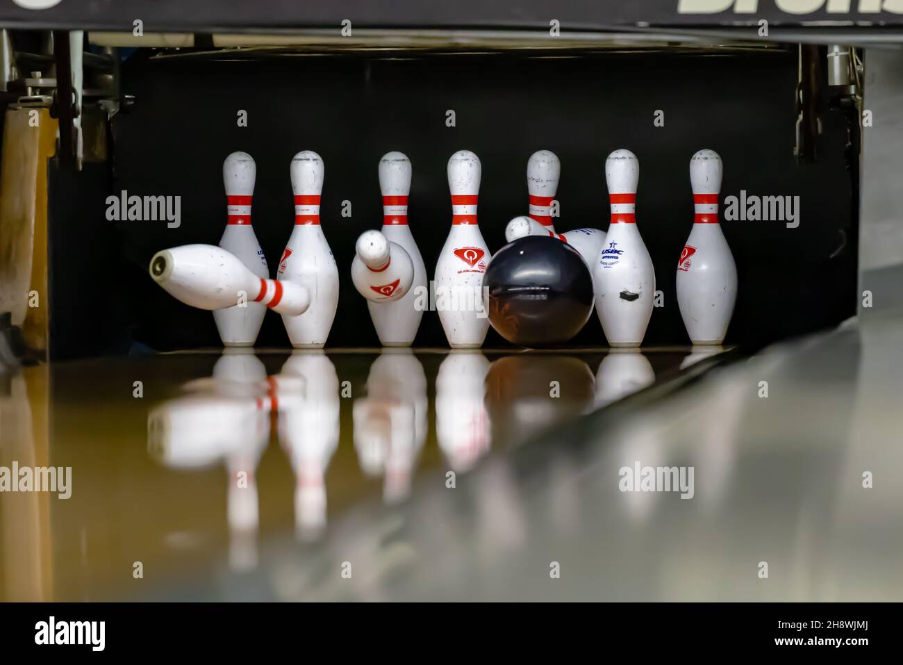 Bowling ball hitting pins at a bowling alley Stock Photo Alamy