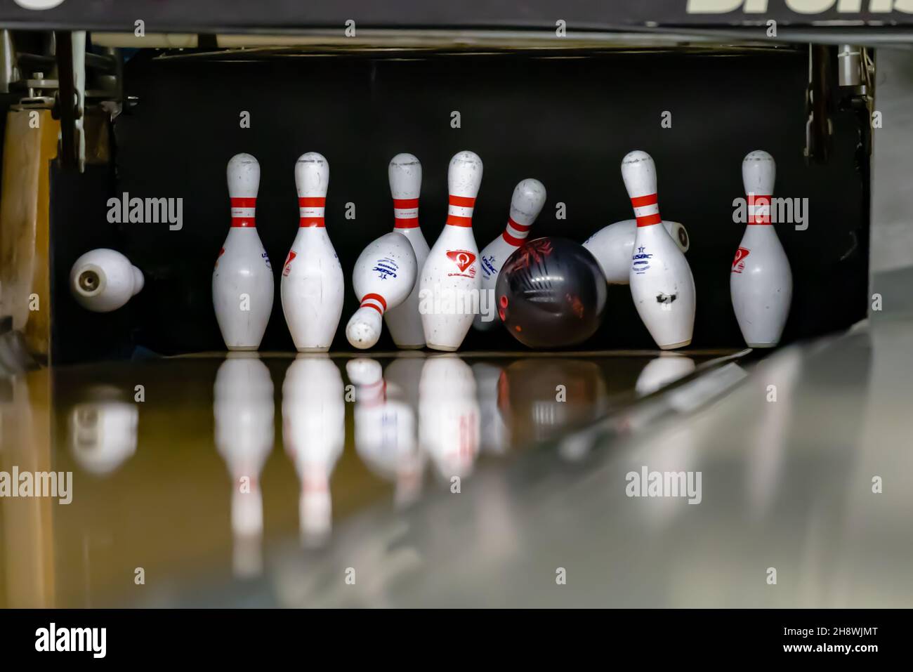 Bowling ball hitting pins at a bowling alley Stock Photo Alamy