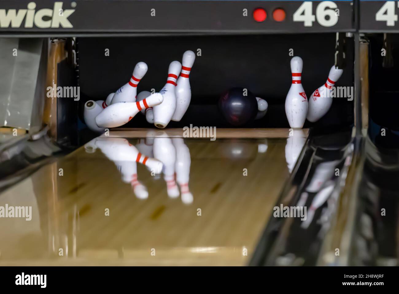 Bowling ball hitting pins at a bowling alley Stock Photo Alamy