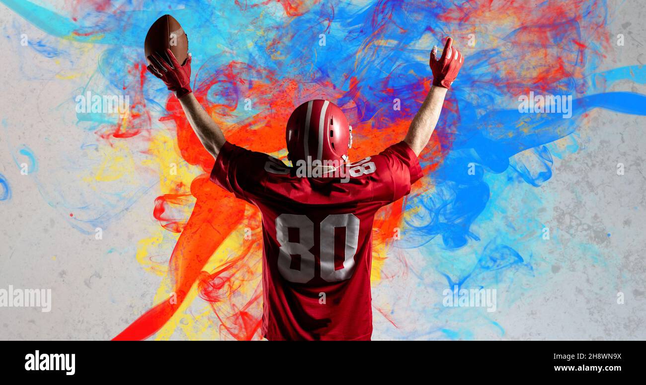 Digital composite image of american footballer celebrating goal over colorful background Stock Photo