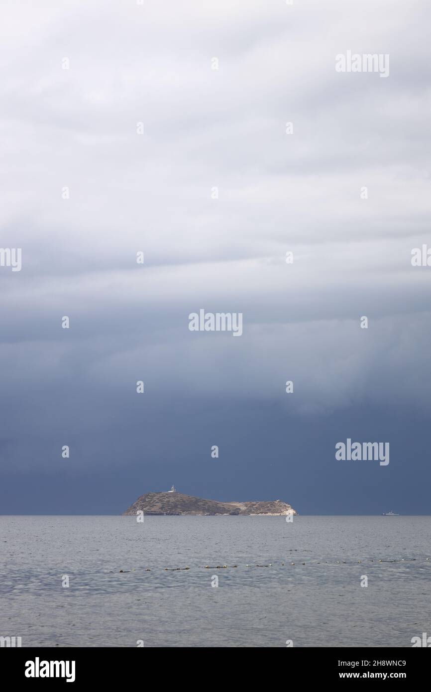 Storm dramatic clouds over the surface of the sea Stock Photo
