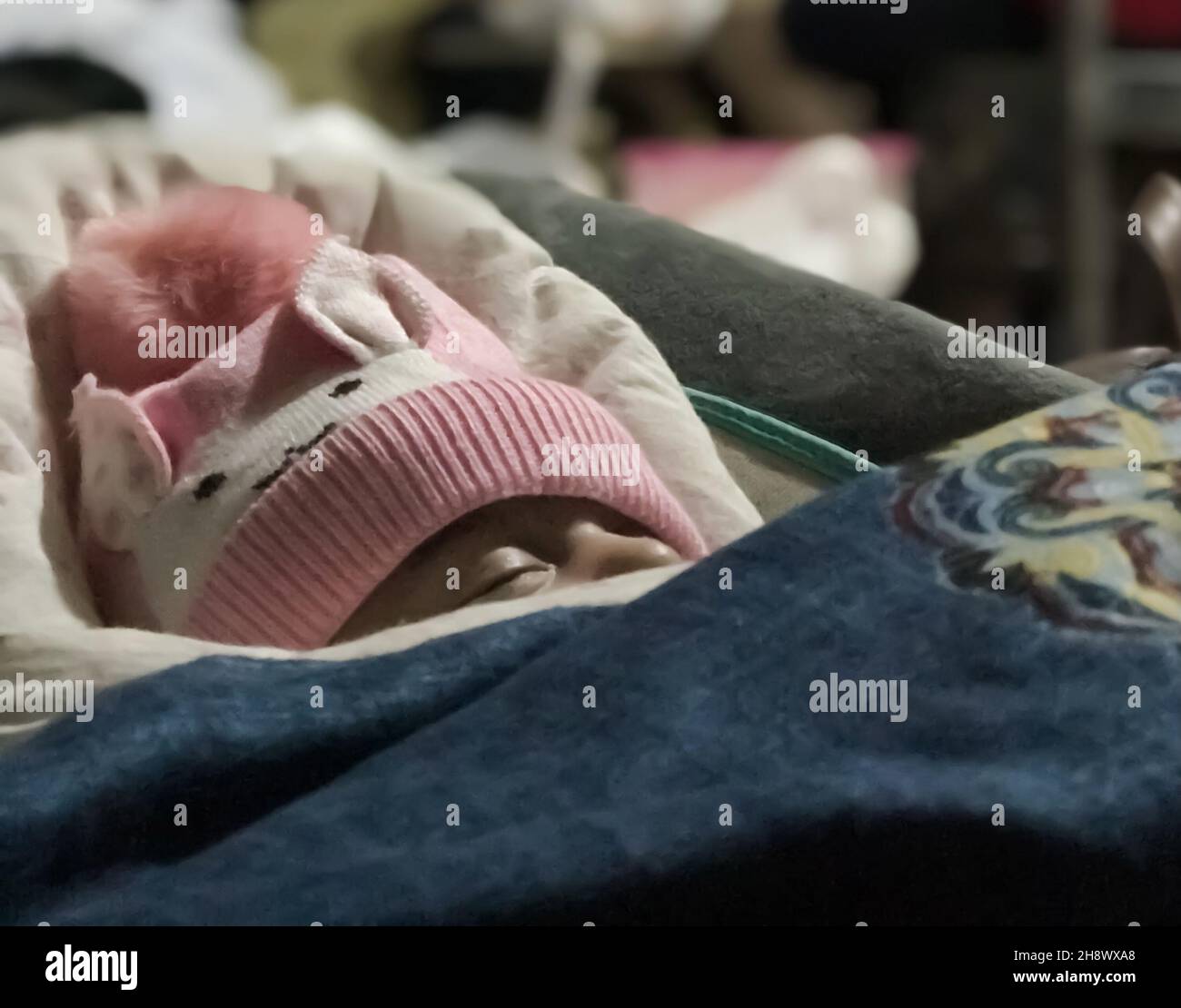 Baby sleeping in a rocker or bouncer Stock Photo Alamy