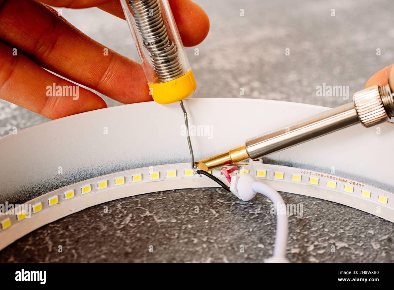 To avoid programmed obsolescence of electronic devices, these can be repaired by soldering. Stock Photo