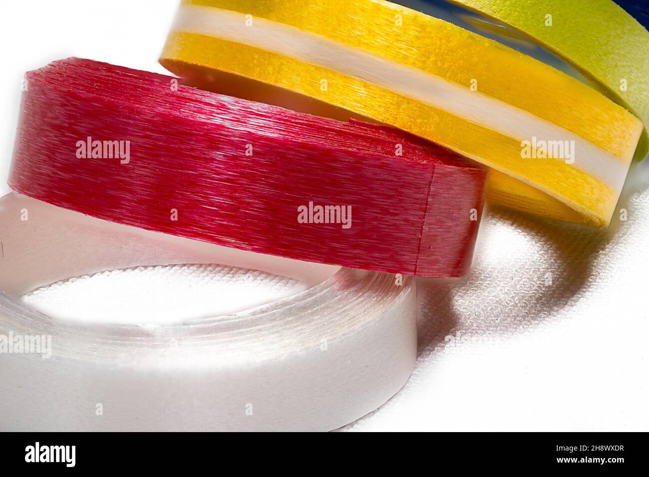 Multi-colored ribbons on a white background Stock Photo