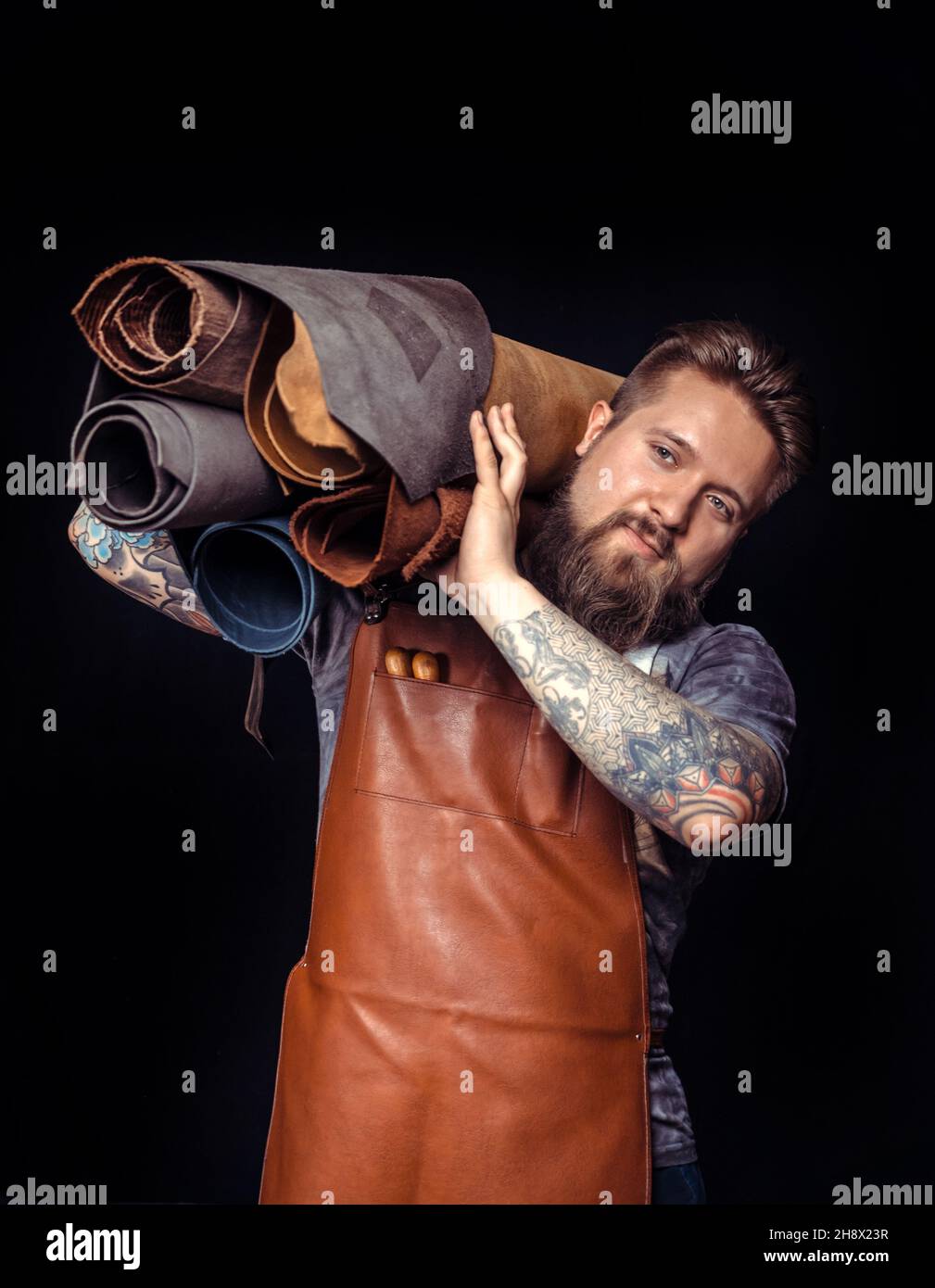 Skinner producing leather workpiece Stock Photo