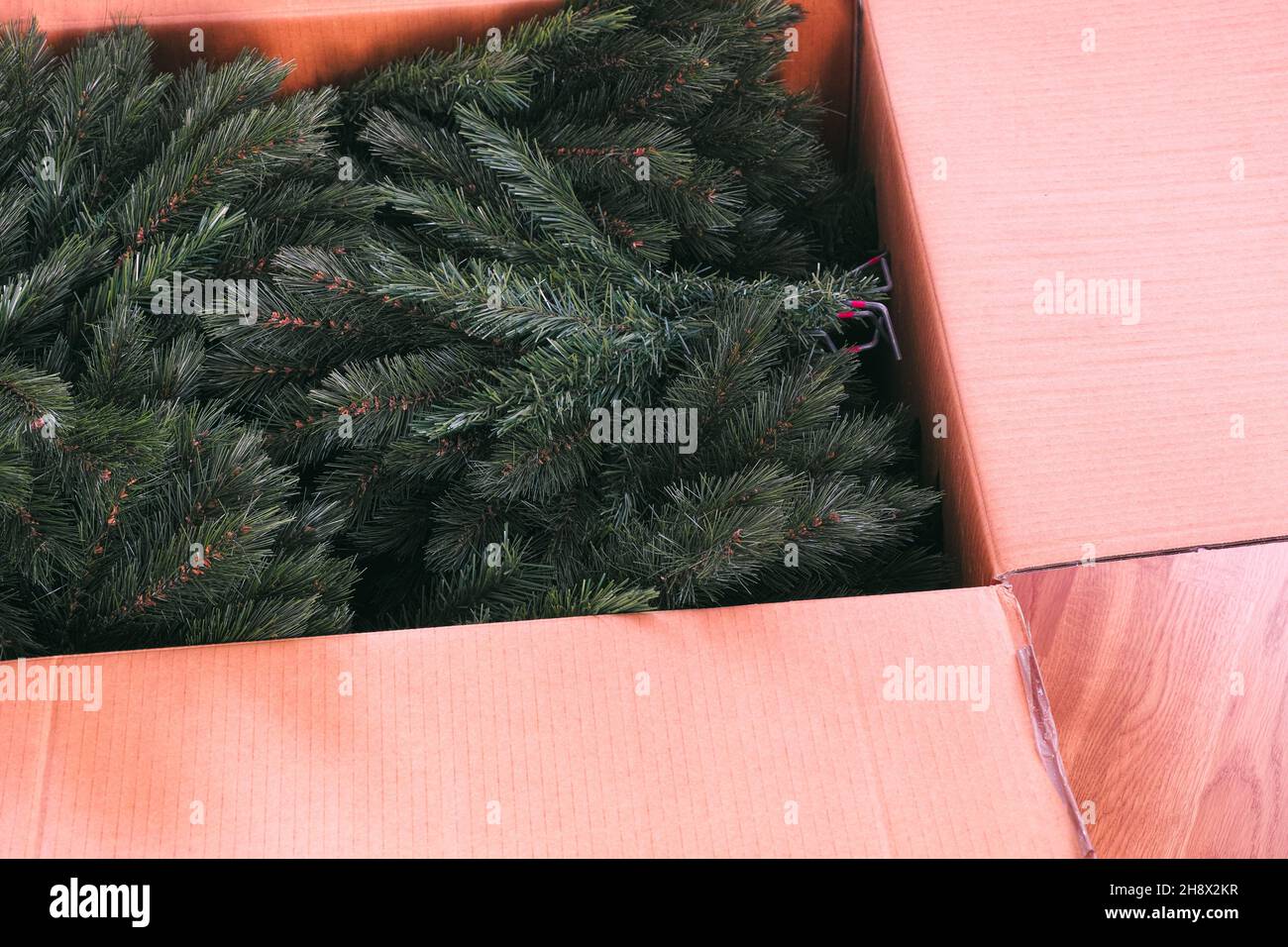Branches from an artificial christmas tree in a large cardboard box. Closeup Stock Photo Alamy
