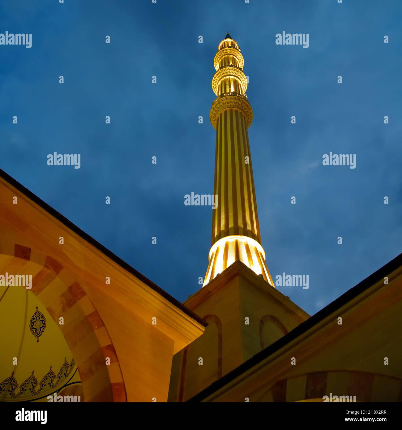 Grozny, Chechnya, Russia. View on the minaret of the Ahmad Kadyrov Mosque Heart of Chechnya shown at night. Selective focus on the minaret Stock Photo