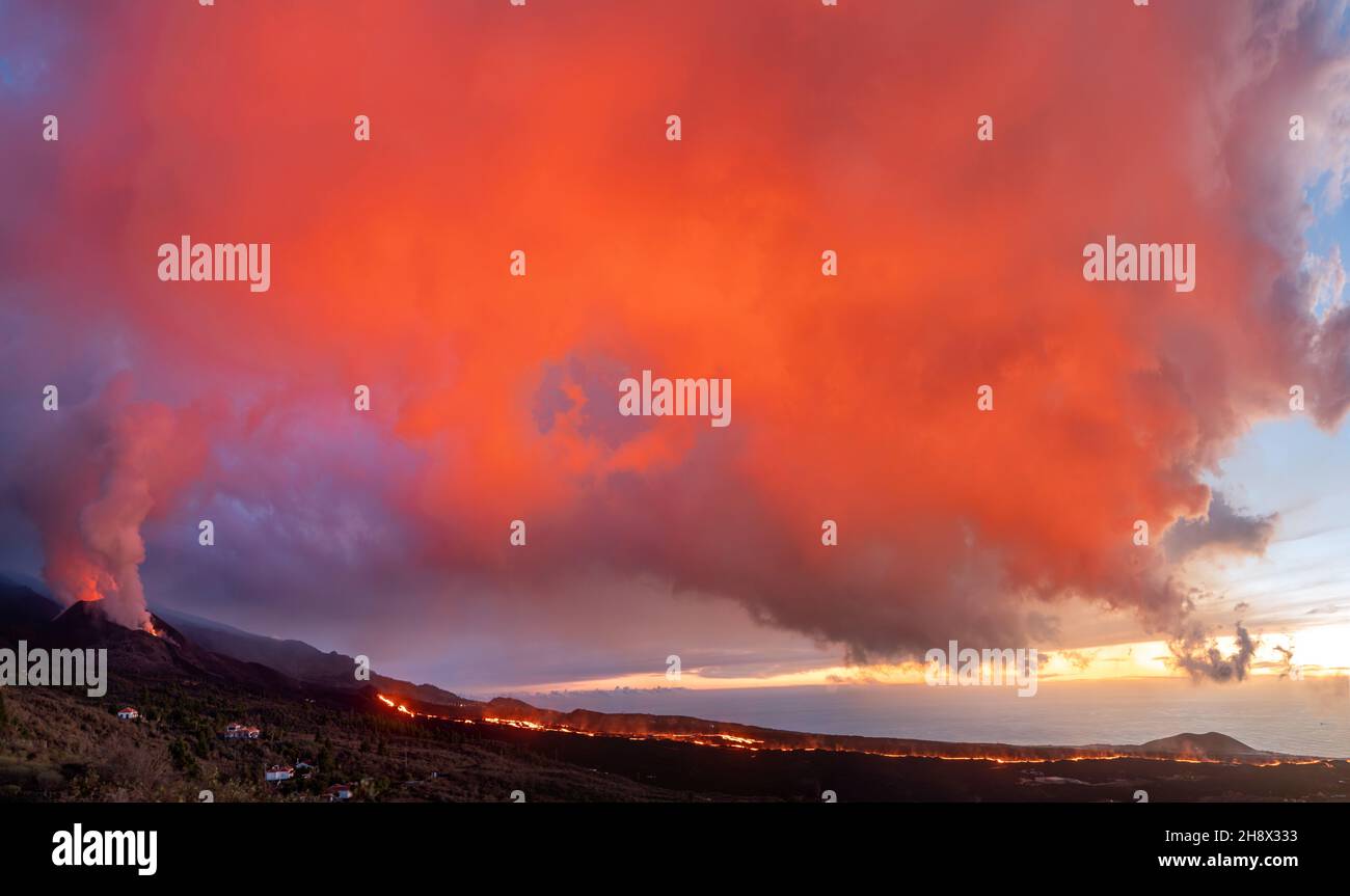115 Volcano Ridge Breathtaking scenery of mountain ridge with erupting volcano ...